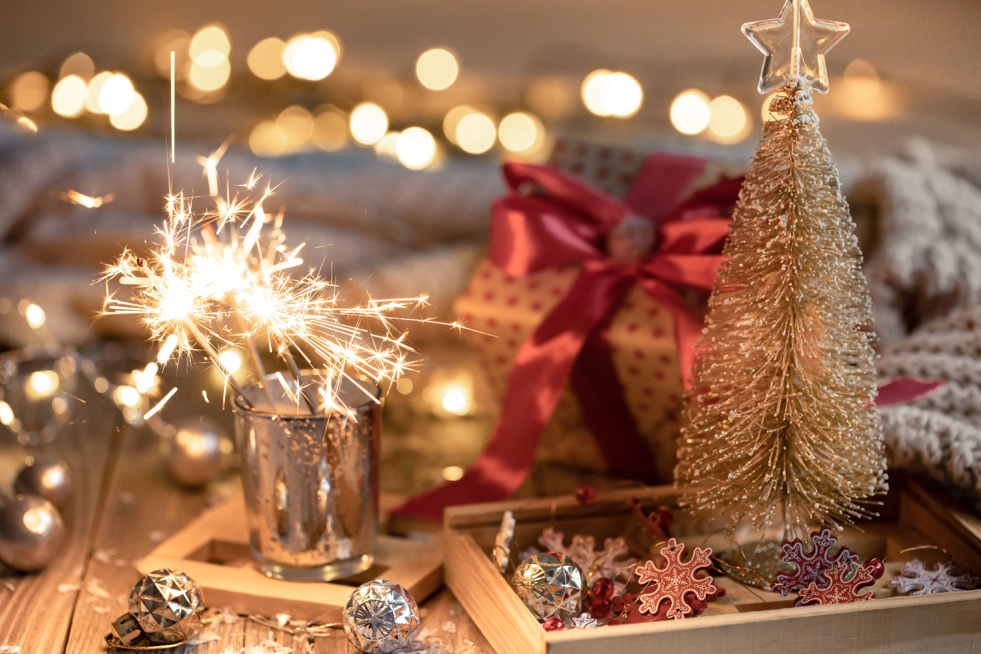 cozy-christmas-background-with-glowing-sparklers-decor-details